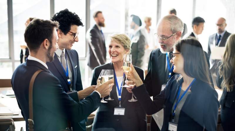 business colleagues giving cheers at a work event