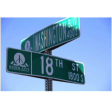 Two street signs intersecting. One says "Washington Blvd" and the other says "18th St."