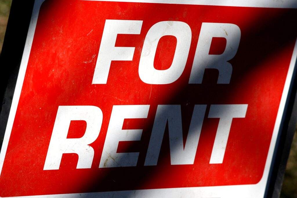 "For Rent" sign for a single family home